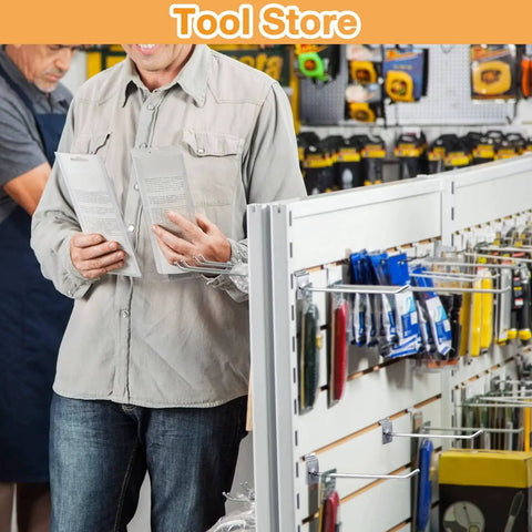 Tool store interior with display of various tools and accessories on slatwall panels.