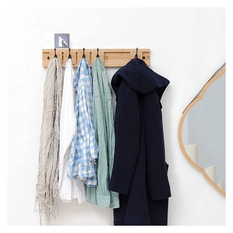 Heavy Duty Wall Mounted Coat Rack With Five Smooth Glide Metal Hooks For Mudroom Bedroom Setup Clothes Hats Towels And Everyday Carry Essentials To Keep Your Space Looking Clean And Organized Today, displaying various garments.
