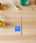 Flame Test Rod Set With Cobalt Glass Filter Sheet and metal alloy wire on a table for classroom chemistry labs use.