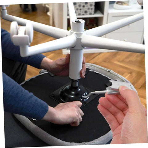 Installing chair using 12-Piece Galvanized Steel Toggle Wing Bolts Kit For Drywall Anchors, focused on bolt adjustment.