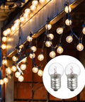 18 Pack E10 Miniature Screw Base Light Bulbs Delivering Hella Bright Warm Yellow Glow 4.8 Volt 2.4 Watt displayed in string lights.