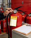 Technician checking fire extinguisher with 15 Pack Self Adhesive Monthly Inspection Stickers Waterproof 3 By 5 Inches Fire Extinguisher Maintenance Labels And Tags For Safety Records Quality Control And Compliance applied.