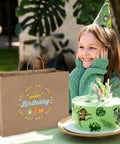 Bulk 400 Pack 16x6x12 Inch Kraft Paper Bags With Handles Reusable For Biz Grocery Birthday Wedding Kids Party And Favors Eco Friendly Recyclable Shopping Bags beside a birthday cake and girl at party