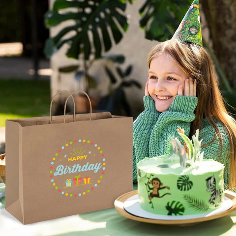 Bulk 400 Pack 16x6x12 Inch Kraft Paper Bags With Handles Reusable For Biz Grocery Birthday Wedding Kids Party And Favors Eco Friendly Recyclable Shopping Bags beside a birthday cake and girl at party