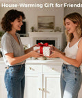 Two people exchanging a house-warming gift in front of a cabinet with 12 pack gold round cabinet knobs set