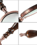 Old School 10X Magnifying Glass With Wooden Handle And Copper Frame, real glass lens details, showing antique design.