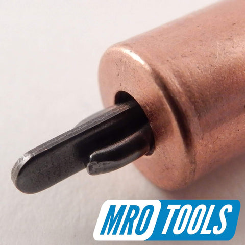 Close-up of a 1/8 inch copper clamp from the One Eighth Inch Cleco Sheet Metal Fasteners Kit With Pliers And Carry Bag for automotive bodywork.