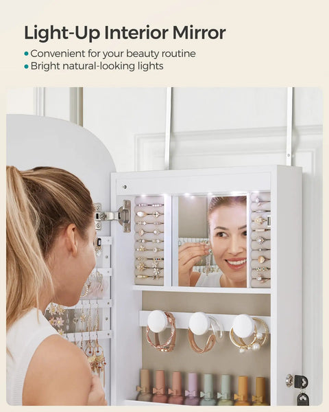 Person using LED Jewelry Cabinet Organizer With Lockable Door And Wall Mount Rounded Wide Mirror Hidden Jewelry Storage Interior Mirror 3.9 x 16.5 x 42.5 Inches White Surface With Greige Lining Dope Modern Sleek Design in bathroom.