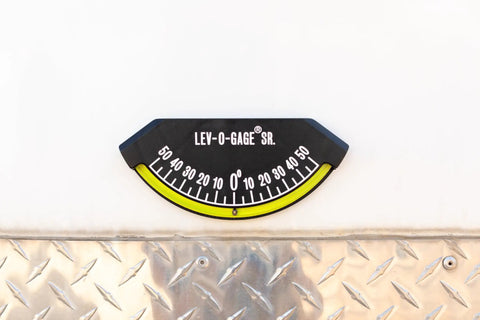 Senior Inclinometer and Tilt Gauge for RVs, Trailers, Campers, and 5th Wheels With High-Bond Adhesive Backing mounted on surface