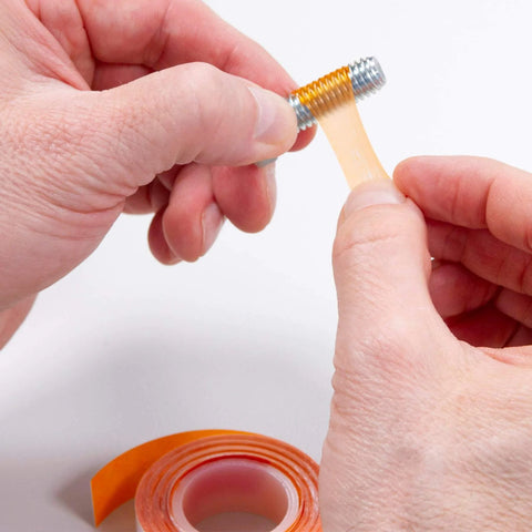 Person applying Instant Threadlocker Tape That Lets You Adjust, Remove, And Reuse Fasteners With No Cure Time to a screw thread