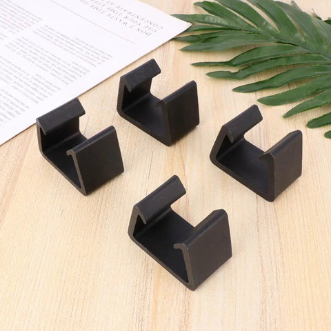4 Pack Sofa Connector Clips For Easy Furniture Fastening, Black Plastic Chair Fasteners With Simple Shape on wooden surface