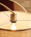 Close-up of Gold Arched Floor Lamp with remote and dimmable bulb highlighting flexible connection and adjustable shade.