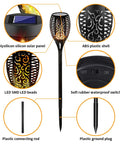 Lit Outdoor Solar Torch Lights Flickering Flame Set Of 12 LED Solar Garden Lights For Pathway Patio Yard Waterproof Auto On Off Each Light Measures 20.4 Inches Long And 2.9 Inches Wide components like ABS shell and solar panel