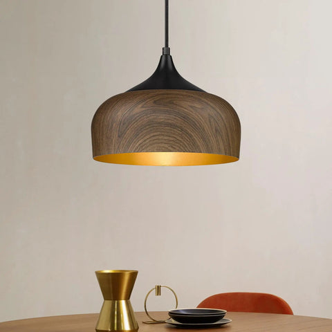 Modern Walnut Wood Dome Pendant Light Matte Black Metal With Warm Gold Interior Adjustable Hanging Fixture over dining table.