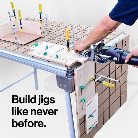 MatchFit Dovetail Clamps for Woodworking Track System Tools 2 Pack Yellow Green Pro Grade Quick Setup Clamping in a Three Eighths Inch Deep Groove That Works With Any One Half Inch Diameter 14 Degree Dovetail Router Bit DVC 538K2 installed on a workbench with woodworking jigs.