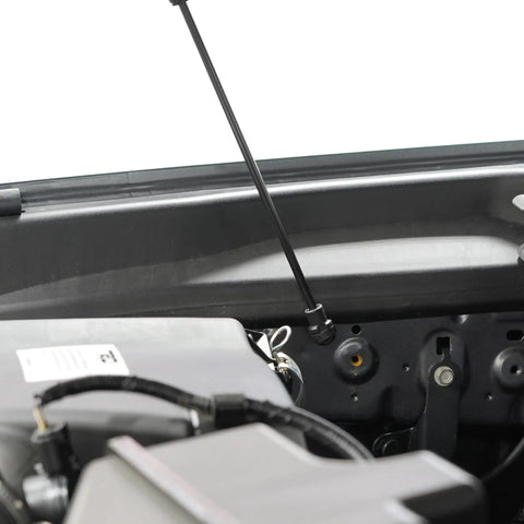 Close-up of the Hood Quicklift Plus System for Toyota Tacoma 2016 2023, showing the prop rod eliminator kit installed.