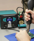 Using Pro Grade 2 In 1 Soldering Iron Station With Hot Air Rework And Sleep Mode for precise electronics repair on circuit board.