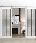 Sliding Double Barn Doors With Frosted Glass Panels And Super Sleek Silver Track Hardware Kit For A Tight Glide To Kick Up Any Space 18 X 96 Inch White Interior Wall Divider in living room setting.