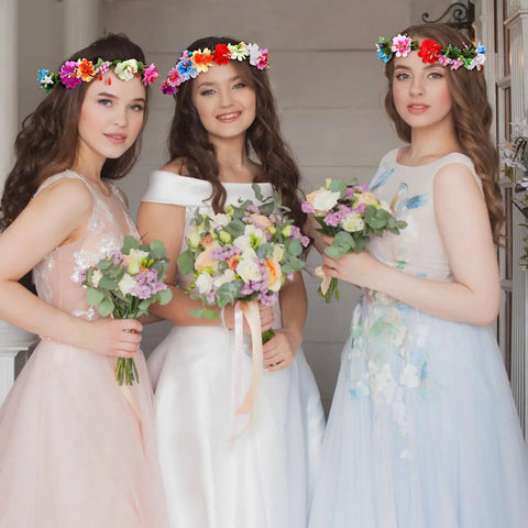 Three women wearing DIY Flower Crown Making Kit With 168 Pieces For Creating Floral Wreath Headbands And Bracelets Craft Set.