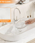 Clear Lazy Susan set of two shown over sink with water pouring, demonstrating easy cleaning and non-slip surface.
