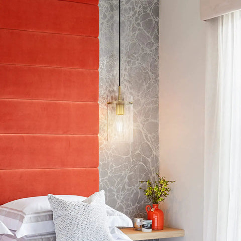 Three Pack Modern Mini Pendant Lights In Brushed Brass With Clear Stripe Glass Shade hanging in a bedroom setting