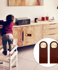 Child reaching cabinet with 2 Pack Classic Brown Cabinet Door Handles No Fuss Single Hole Mount Solid Brass Drawer Pulls visible in inset