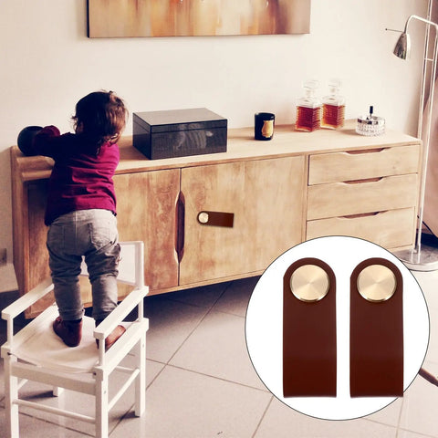 Child reaching cabinet with 2 Pack Classic Brown Cabinet Door Handles No Fuss Single Hole Mount Solid Brass Drawer Pulls visible in inset