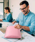 Person using large bubble mailers 12x16 inch pack of 25 no fuss usable inner 12x15 inch size light pink padded envelopes waterproof self seal