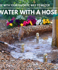 Super Handy Eight Inch Deep Root Watering Stakes Four Pack In Tan installed in garden near flowers with water hose use