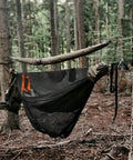 Double Camping Hammock With Mosquito Net Ridgeline And Straps 11Ft Lightweight Nylon Ripstop 500lb Capacity set up in a forest.