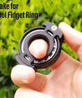 Hand holding Aluminum Alloy Fidget Ring For Men Dope Anxiety Relief Toy With 6804 Ball Bearing Chain Bike Sound Nuclear Reactor Design