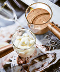 Single Spout Espresso Shot Glass With Wood Handle Measuring Cup Set, 75 Ml Two Pack, Borosilicate Glass Milk Cup filled with cream and sauce