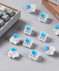 Blue 3-Pin Mechanical Keyboard Switches 200 Pack With Dustproof Housing, Clicky Tactile Feel, 50 Million Click Life, Replacement Keys For Gaming Keyboards, Ideal For 3D Printing Projects And Fidget Builds on a keyboard