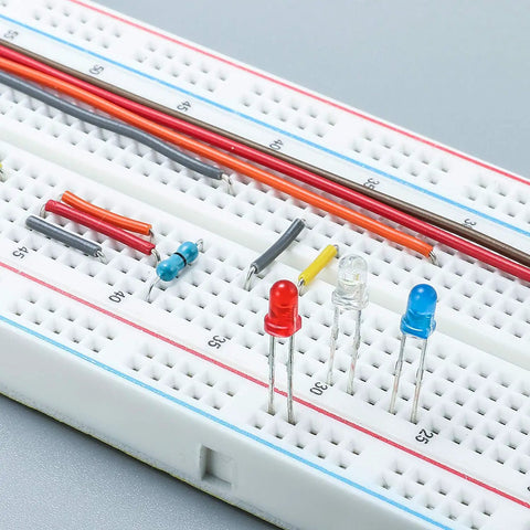Three Pack Jumper Wires And Three Solderless Breadboard Sets With 830 Tie Point Breadboards showing color-coded jumpers and LEDs