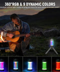Rechargeable Camping Lantern With RGB Light 550LM Brightness Waterproof Tent Light in use near campfire with guitarist