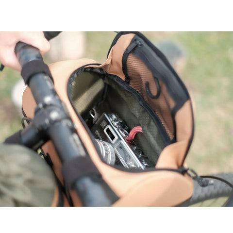 Open Everywhere Handlebar Bag 5L Rigid Front Barrel Pack with Foam Spacer Kit on bike handlebar showing camera inside