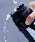 Pouring water from Leak Resistant Squeeze Lid Water Bottle For Biking And Hiking, Lightweight Sports Bottle With Wide Mouth