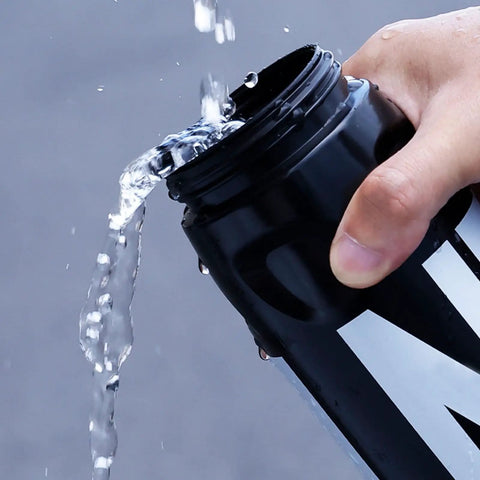 Pouring water from Leak Resistant Squeeze Lid Water Bottle For Biking And Hiking, Lightweight Sports Bottle With Wide Mouth