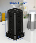 12 Outlet Surge Protector Power Strip With 4 USB Ports And A 10 Foot Cord, Fireproof Overload Protection next to speaker