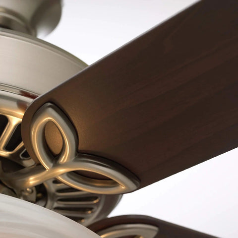 Close-up of Traditional Style 42 Inch Five Blade Ceiling Fan in White with frosted globes and light kit, showing fan blade attachment.