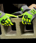 TRX T Rex ANSI A5 Lightweight HPPE Shell Impact Gloves With Sandy Nitrile Palm Coating For A Grippy Wet Grip And Solid Cut Protection, 1 Pair, Size 10 XL, Model TRX441 shown lifting a cinder block