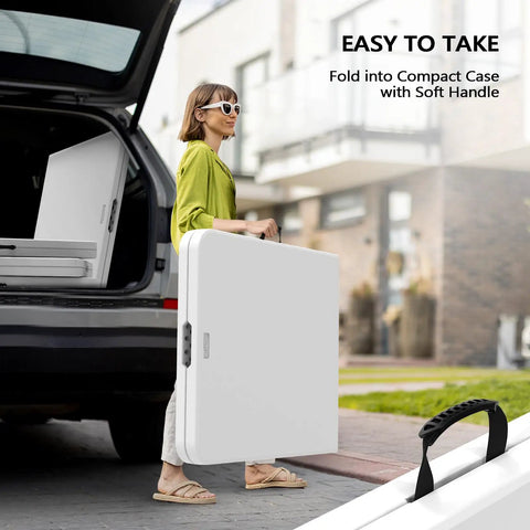 Woman carrying Six Foot Folding Table For Indoor Outdoor Use, Portable Long Rectangular Table With Carrying Handle, folded state