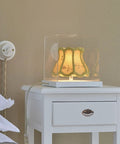 Antique drawer handle on white bedside table with lamp, 4 Pack Antique Alloy Drawer Handles Ring Pulls With Retro Wooden Case Look.