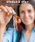 Person holding keys with Neon Orange Silicone AirTag Keychain Case With Ring Waterproof AirTag Holder Durable Full Body Cover for Kids