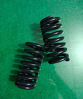 Heavy Duty Compression Springs Set, High Tensile Steel Coil Design, 135Mm Length And 65Mm Outer Diameter, industrial coils on a green background.