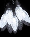 100 Pack Pure White C9 LED Christmas Light Bulbs, Dimmable And Shatterproof, E17 Base, close-up with bright two LEDs per bulb.