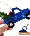Blue Vintage Iron Christmas Truck Ornament For Christmas Tree, Rustic Farmhouse Style Hangable Pendant Decor, Small Vintage Pickup Ornament Hauling A Festive Tree Dope Holiday Decor shown with a lanyard hole.