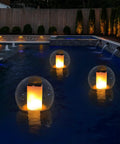 Solar Powered Floating Globes For Pool Pond Patio And Hot Tub Outdoor Lanterns That Look Like Candles Or Torches Perfect Party Decor And Chill Ambience A Fun Gift For Adults And A Must Have Pool Toy glowing on a pool surface