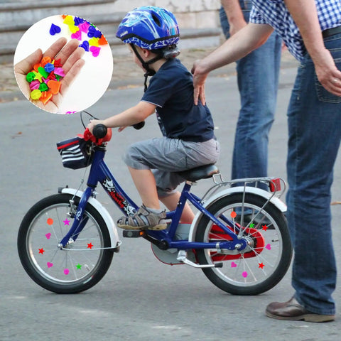 Child riding bike with 210 Pcs Bike Wheel Spokes Beads Set For Kids - Colorful Plastic Clip Beads In Star, Heart, Ball Shapes