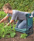 Woman using 2 In 1 Garden Kneeler Bench With Tools Pouch Folding Garden Stool for Patio And Yard during gardening.